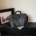 Large capacity black travel duffel bag with grid pattern, sturdy handles and strap. - 40*21*28 / Black
