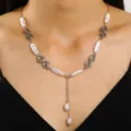 Macro view of a vintage Y-shaped necklace featuring baroque pearls and silver spiral links - Silver Baroque Pearl Y-Style (白k 10912)