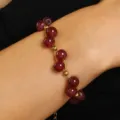 Vintage red round bead bracelet with elegant gold separator beads worn on a female wrist - Bead Bracelet(6885)