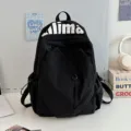 Lightweight black backpack with water-resistant fabric, large capacity for daily use and travel. - Black