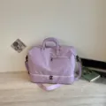 Large capacity purple travel duffel bag with shoulder strap, ideal for gym and weekend trips. - Purple