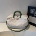 Large capacity travel duffel bag for women and men, weekend overnight bag with green handles. - Off White