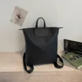 Minimalist black commuter backpack, lightweight large capacity casual travel school bag. - Black