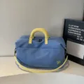 Blue travel duffel bag with yellow handles, large capacity sports gym bag for short trips. - Blue
