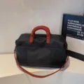 Black travel duffel bag with red handles, large capacity gym and sports luggage bag for travel. - Black