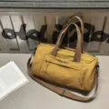 Yellow canvas travel duffel bag with shoulder strap and front pocket, perfect for gym and sports. - 39*22*22 / Turmeric