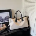Large capacity travel duffel bag for men and women, stylish canvas weekender bag for gym. - Off White
