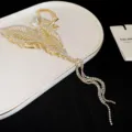 Gold rhinestone leaf hair claw clip with pearl and tassel dangles for elegant women styling. - Gold Leaf Tassel Rhinestone Style (HH3395) / Gold
