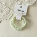 Light green transparent telephone wire hair band with cute patterns and white hanging tag. - Two-Piece Set / Green Bunny