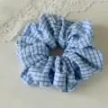 Blue plaid hair scrunchie detail shot, elegant fabric hair tie, soft elastic ponytail holder. - Regular Fit / Blue