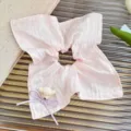 Detailed shot of sweet pink hair scrunchie with cute bear and bow, perfect for daily styling. - Light Pink Bear Square Scarf