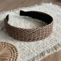 Close-up detail of the woven wide headband, featuring exquisite straw texture and design. - Rattan Woven Coffee Hair Accessory