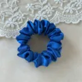 Close-up of a vibrant royal blue satin hair scrunchie featuring a glossy texture and soft surface. - Small Size Blue 9cm