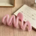 Pink wave hair claw clip detail shot, elegant aesthetic dopamine design for daily hairstyles. - Dopamine Pink