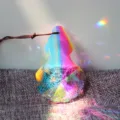 Detailed close-up shot of crystal suncatcher pendant with vibrant rainbow refractions. - 76mm Floral Gourd