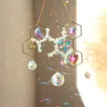 Close-up details of the honeycomb crystal suncatcher featuring rainbow glass pendants and chips. - Aquamarine
