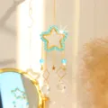 Acchiappasole in cristallo da appendere con forma di stella, perline blu e luce arcobaleno. - Motivo a Stelle Blu