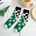 Green checkerboard cotton mid tube socks with trendy rhombus and cute smiley patterns for daily wear. - Green Checkered