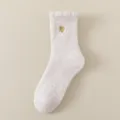 Chaussettes pelucheuses douillettes pour femmes, chaussettes d'hiver chaudes coeur brodé. - Taille unique / Blanc