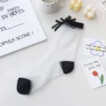 Calzini da donna in seta di cristallo trasparente con fiocco nero e punta a contrasto. - Taglia unica / Fiocco Nero