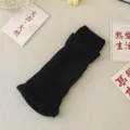 Solid black knit leg warmer, cozy winter y2k long socks, stylish ribbed boot cuffs for women. - One Size / Black