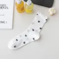 White ruffle mid-calf socks for women featuring breathable mesh design and black bow prints. - One Size / Bow White