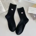 Black speckled cotton knit crew socks featuring cute pink heart embroidery for women style. - Black