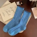 Gemütliche blaue Wollstrümpfe für Damen mit süßen Rüschenbündchen für warme Wintertage. - Einheitsgröße / Blau