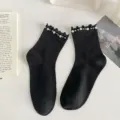 Black mid-tube socks featuring delicate ruffled cuffs and elegant pearl and bead embellishments. - One Size / Pearl Black