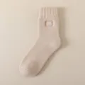 Men's thermal knit crew socks in beige color with embroidered patch for winter daily warmth. - Beige