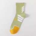 Green athletic basketball socks, mid-tube design with white stripes and yellow toe. - One Size / Green