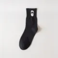 Men's black cotton mid-tube socks featuring a stylish bearded man graphic print, trendy everyday wear. - One Size / Black