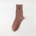 Brown men's mid-tube cotton socks with cool hipster face print, trendy casual style footwear. - One Size / Coffee