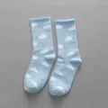 Light blue crew socks featuring cute white clouds pattern, soft cotton casual socks for men and women. - One Size / Light Blue