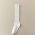 White solid color ribbed calf socks for women, comfortable cotton knee high fashion hosiery. - One Size / White
