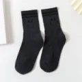 Dark grey striped mid-calf socks for women featuring cute smile face pattern design. - One Size / Dark Gray