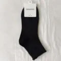 Solid color black women short socks with delicate ruffle edge, comfortable cotton variant. - One Size / Black
