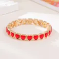 Close-up of a stylish red heart-shaped crystal stretch bracelet with golden metal details! - Red Heart Rhinestone Style (SL1573)