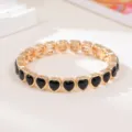 Gold-tone metal black heart stretch bracelet for women fashion stylish love link wrist jewelry - Black Heart Style (SL1577)