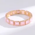 Elegante pulsera elástica de cristal rosa con piedras cuadradas geométricas doradas. - Dorado Cristal Rosa Fucsia