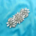 Detailed view of crystal rhinestone bridal belt applique, sparkling diamond wedding dress patch. - Silver