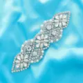 Detailed shot of sparkling rhinestone and pearl decorative patch for bridal dress and belt. - Silver