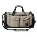 Detailed view of the large capacity travel duffel bag featuring dual front pockets and shoulder strap. - Khaki