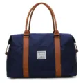 Borsa da viaggio blu con manici marroni, grande borsa bagaglio in tela per donne uomini. - Taglia L / Blu