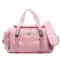 Pink travel gym bag with large capacity, lightweight design, and convenient wet-dry separation. - Pink