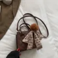 Brown quilted shoulder bag with chic silk scarf and plush ball pendant for women variant - Coffee