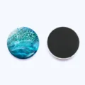 Close up detail of round ocean wave glass fridge magnet with soft magnetic backing for whiteboards. - Style 10