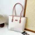 Large capacity color block tote bag for women, stylish embossed shoulder commuting bag. - Double-Sided Embossed Pink