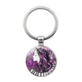 Stylish music themed metal keychain featuring a purple art glass cabochon pendant. - Girl Notes Piano Key Style (JY9706-3)