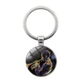 Metal music themed keychain with glass cabochon pendant, stylish musical instrument accessory. - Line Art Musician Style (JY9706-8)